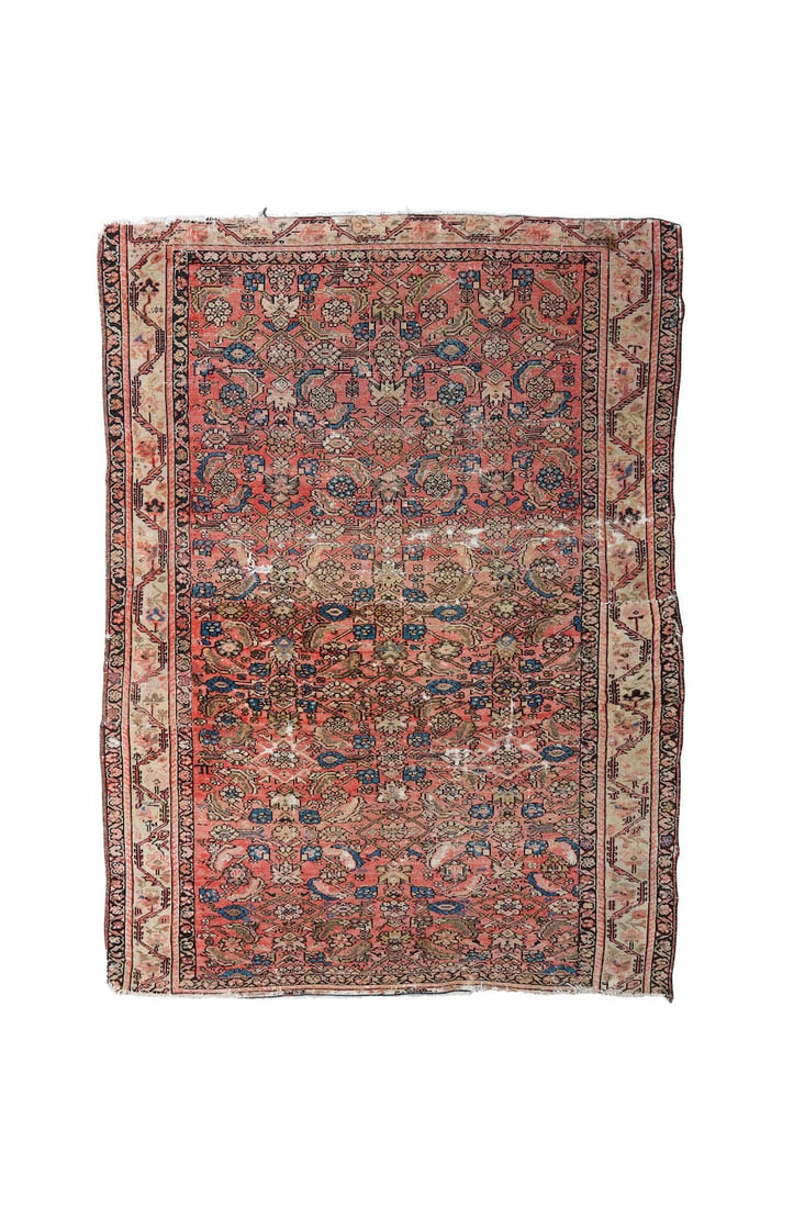 An Iranian rug,: An Iranian rug, fragment, worn, with losses to the border and tears, in red and blue tones, with fading, 142.0 x 104.0cm This lot is subject to the following lot symbols: TP TP Please note this lot