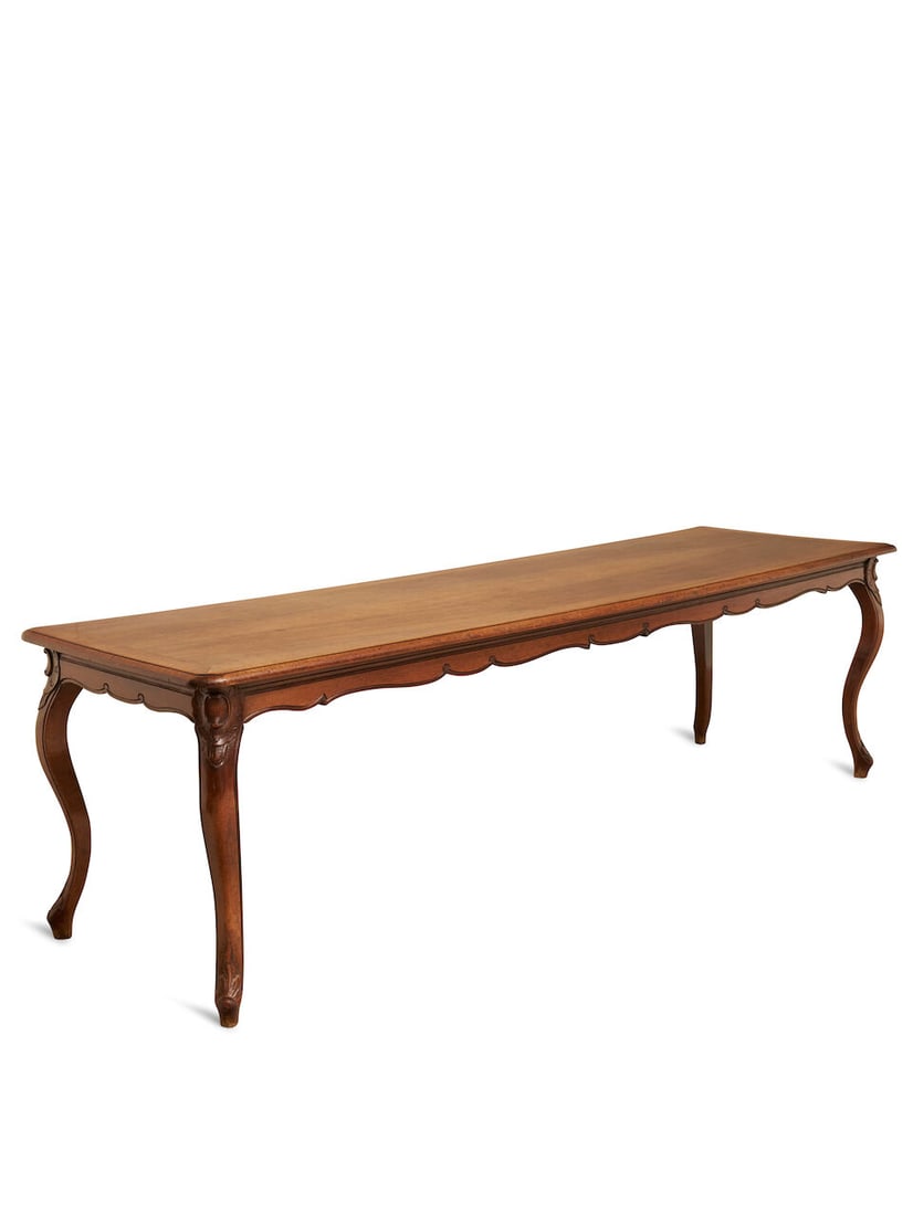 A Louis XV style walnut dining table, French,: A Louis XV style walnut dining table, French, with long rectangular top, upon a shaped apron, raised on cabriole legs, height: 73.0cm, length: 250.0cm, width: 74.0cm, accompanied by an alternate hinge