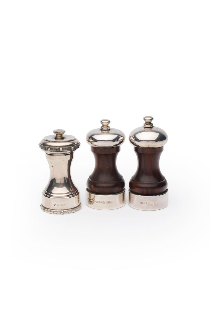 Dunhill and Whitehall & Co.| pepper mills one example marked Alfred Dunhill & Sons, Birmingham, ...: Dunhill and Whitehall & Co.| pepper mills one example marked Alfred Dunhill & Sons, Birmingham, 1981 the Dunhill in sterling silver, of waisted cylindrical form decorated with bands of stylised dragon