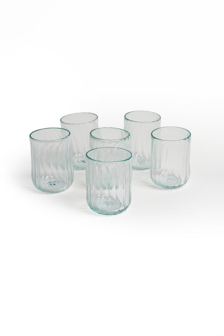 A set of six hand-blown water glasses French, 20th century: A set of six hand-blown water glasses French, 20th century Spiral pattern with green tint, height: 9.5cm (6) For further information on this lot please visit Bonhams.com For further information about