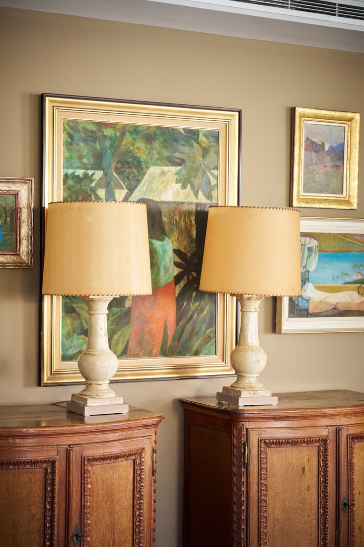 A pair of glazed stoneware table lamps 18th/19th century (2): A pair of glazed stoneware table lamps 18th/19th century glazed stoneware baluster stems converted with cream simulated parchment shades, trimmed with leather binding and wired for electricity, height