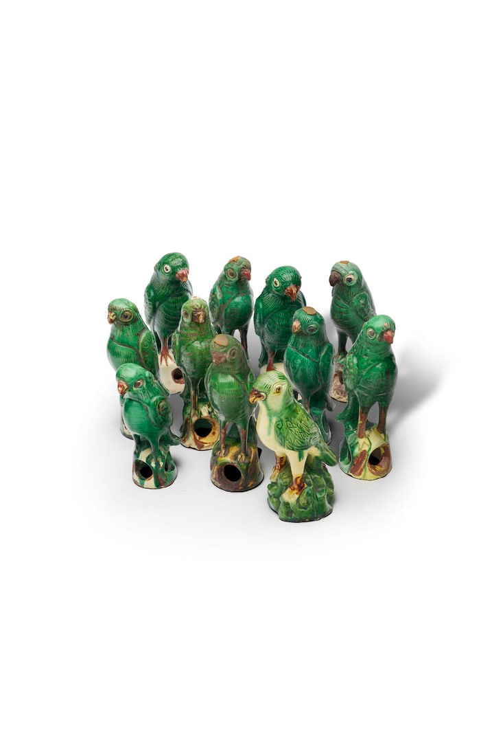 A flock of famille verte pottery models of parrots China, late 19th to early 20th century (11): A flock of famille verte pottery models of parrots China, late 19th to early 20th century height: 22.0cm - 23.5cm (11). For further information on this lot please visit Bonhams.com For further