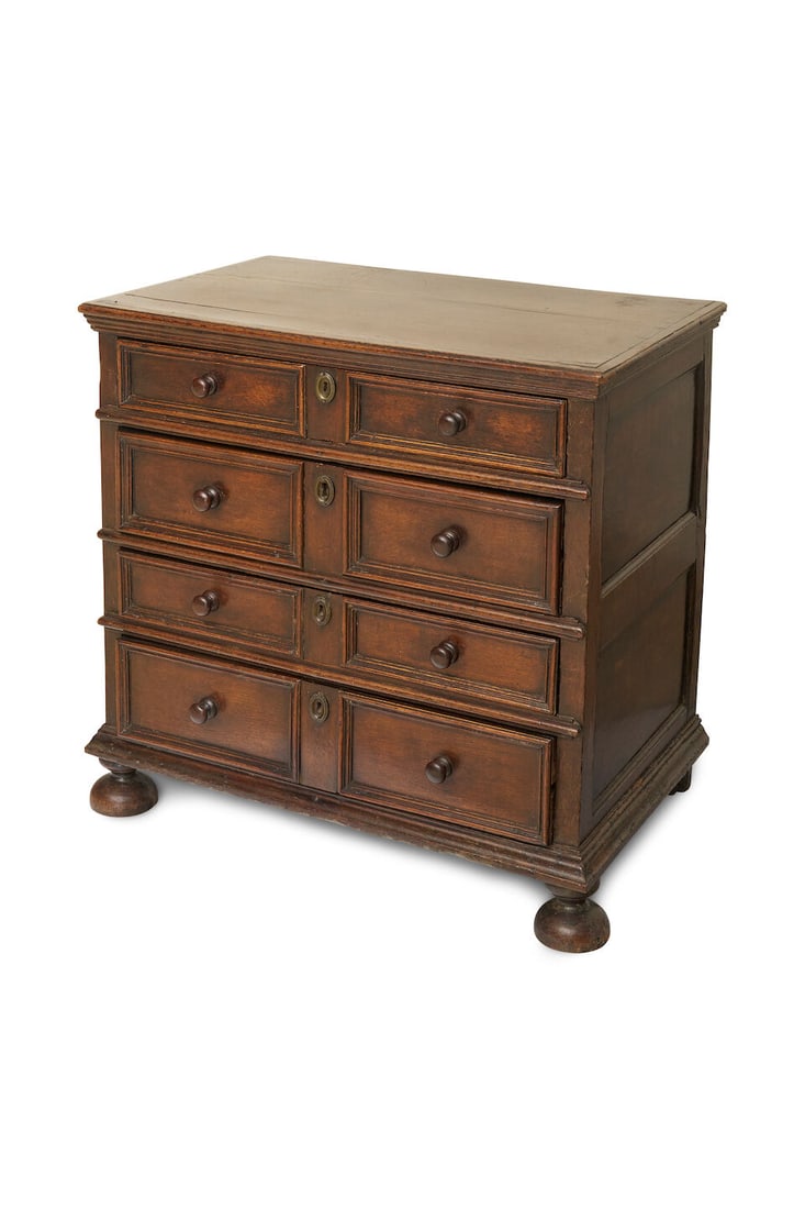 An English oak chest of drawers, c.1700: An English oak chest of drawers, c.1700 raised on later bun feet, height: 85.0cm, width: 89.0cm, depth: 55.0cm This lot is subject to the following lot symbols: W TP W Please note that this lot requir