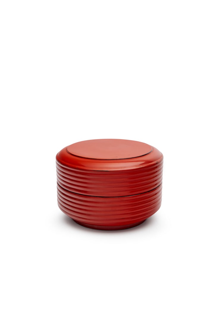 A Negoro lacquer circular box, Japan, 19th century: A Negoro lacquer circular box, Japan, 19th century in two sections with fluted sides and black interior, signed to base, height: 17.0cm, diameter: 27.0cm Footnotes: Provenance David Jones Art Gallery,