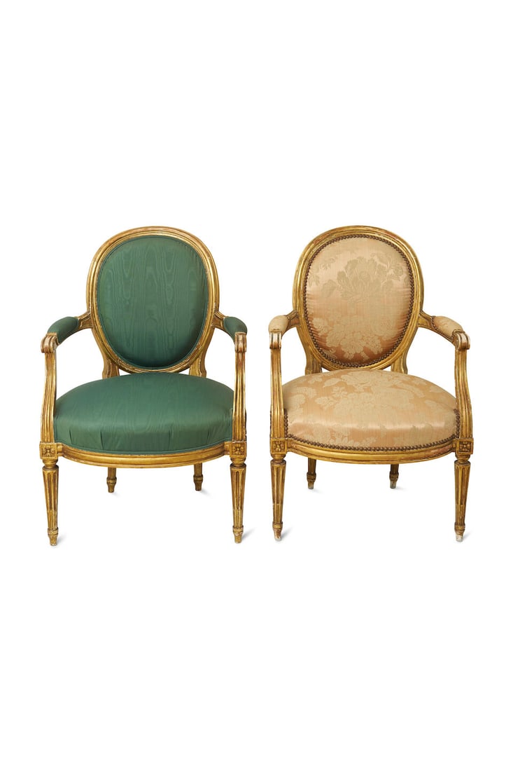 A pair of Louis XVI style giltwood armchairs, French,: A pair of Louis XVI style giltwood armchairs, French, with oval back and bow seat rail raised on tapering fluted legs, alternate upholstery, height: 90.0cm, width: 62.0cm, depth: 55.0cm This lot is su