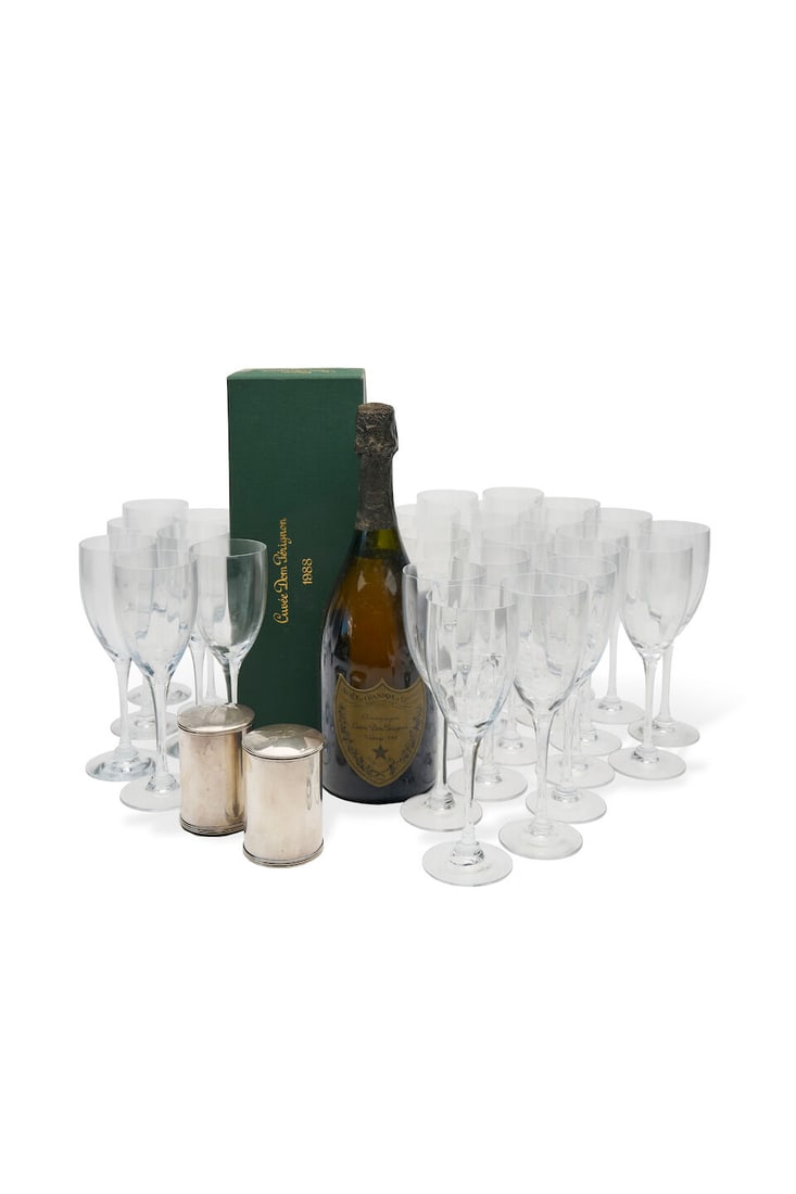 Orrefors | 26 champagne flutes, two champagne stoppers and a bottle of Dom Pérignon Cuv...: Orrefors | 26 champagne flutes, two champagne stoppers and a bottle of Dom Pérignon Cuvée, 1988, with original Dom Pérignon presentation box, together with two silver plated champagne