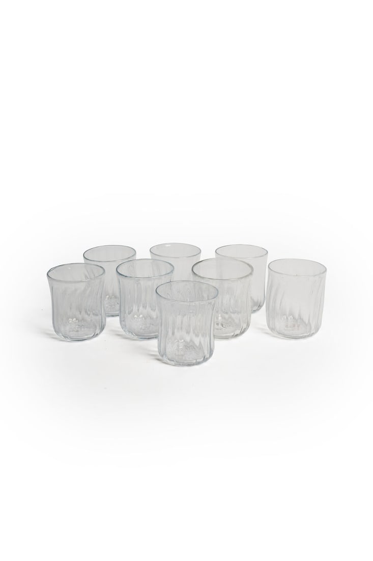 A set of eight hand-blown water glasses French, 20th century: A set of eight hand-blown water glasses French, 20th century Each clear handmade glass blown in a spiral pattern, height: 8.0cm (8) For further information on this lot please visit Bonhams.com For