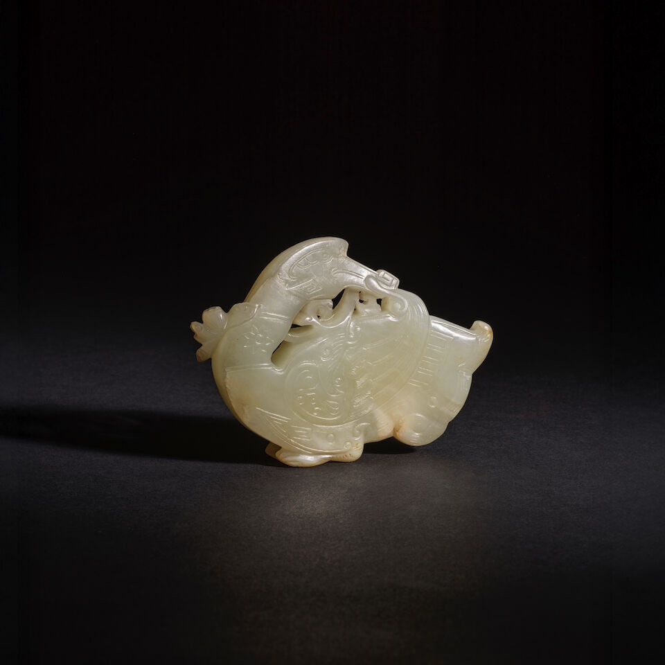 CANARD EN JADE CÉLADON SCULPTÉ Dynastie Qing, XVIIIe siècle (2): CANARD EN JADE CÉLADON SCULPTÉ Dynastie Qing, XVIIIe siècle A CELADON JADE DUCK Qing Dynasty, 18th century Wood stand 9.5 cm (3 3/4 in.) long (2). Footnotes: Provenance: Formerly in