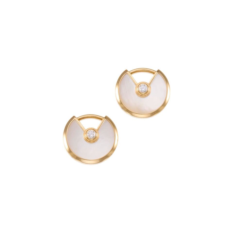 CARTIER: 18K GOLD AND MOTHER OF PEARL EARRINGS: CARTIER: 18K GOLD AND MOTHER OF PEARL EARRINGS • 18K yellow gold • Two carved mother of pearl measuring approximately 10.44mm in diameter • Two round shaped diamonds weighing