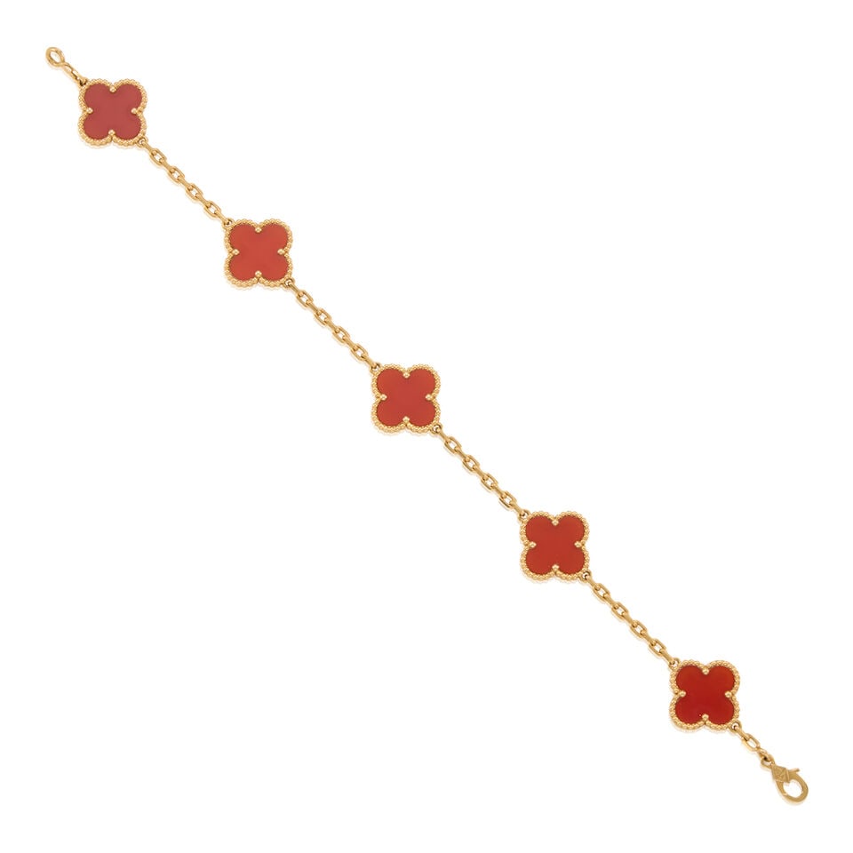 VAN CLEEF & ARPELS: 18K GOLD AND CARNELIAN 'ALHAMBRA' BRACELET: VAN CLEEF & ARPELS: 18K GOLD AND CARNELIAN 'ALHAMBRA' BRACELET • 18k yellow gold • 5 Carnelian quatrefoils • Signed VCA, French assay mark, Swiss assay mark, serial number, and