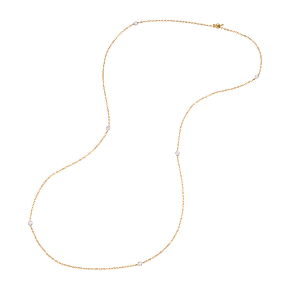 ELSA PERETTI FOR TIFFANY & CO.: 18K GOLD AND DIAMOND NECKLACE: ELSA PERETTI FOR TIFFANY & CO.: 18K GOLD AND DIAMOND NECKLACE • 18k yellow and white gold • 6 round diamonds weighing approximately 0.40 - 0.50 carat total • Signed PERETTI, TIFFANY