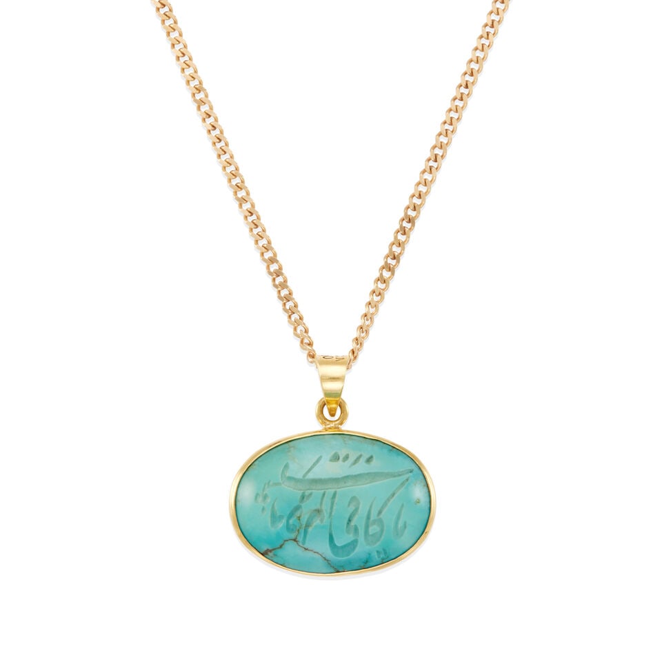 GOLD AND CARVED TURQUOISE PENDANT NECKLACE: GOLD AND CARVED TURQUOISE PENDANT NECKLACE • 14K and 18K yellow gold • One carved turquoise measuring approximately 23.67mm x 16.92mm • Pendant length 1 in • Chain length: 15