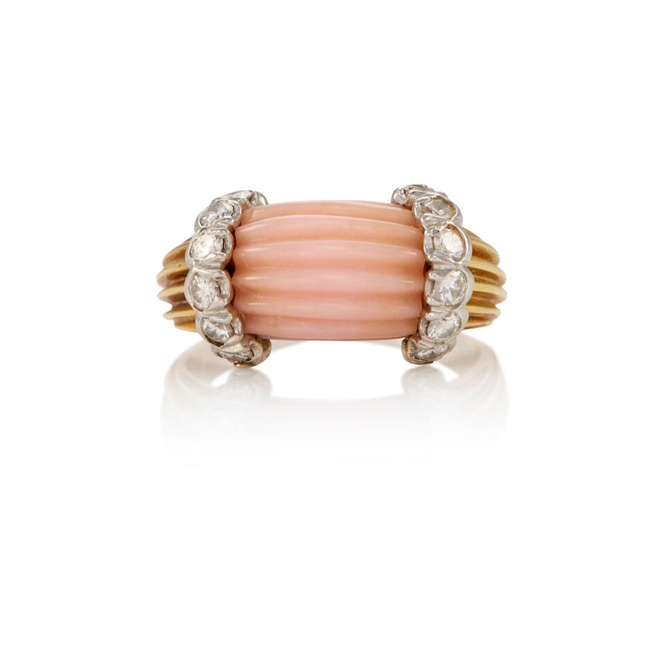 VINTAGE 14K GOLD, CORAL, AND DIAMOND RING: VINTAGE 14K GOLD, CORAL, AND DIAMOND RING • 14K yellow gold • One carved coral with ridges measuring approximately 11.07mm x 9.66mm • Numerous round shaped diamonds weighing