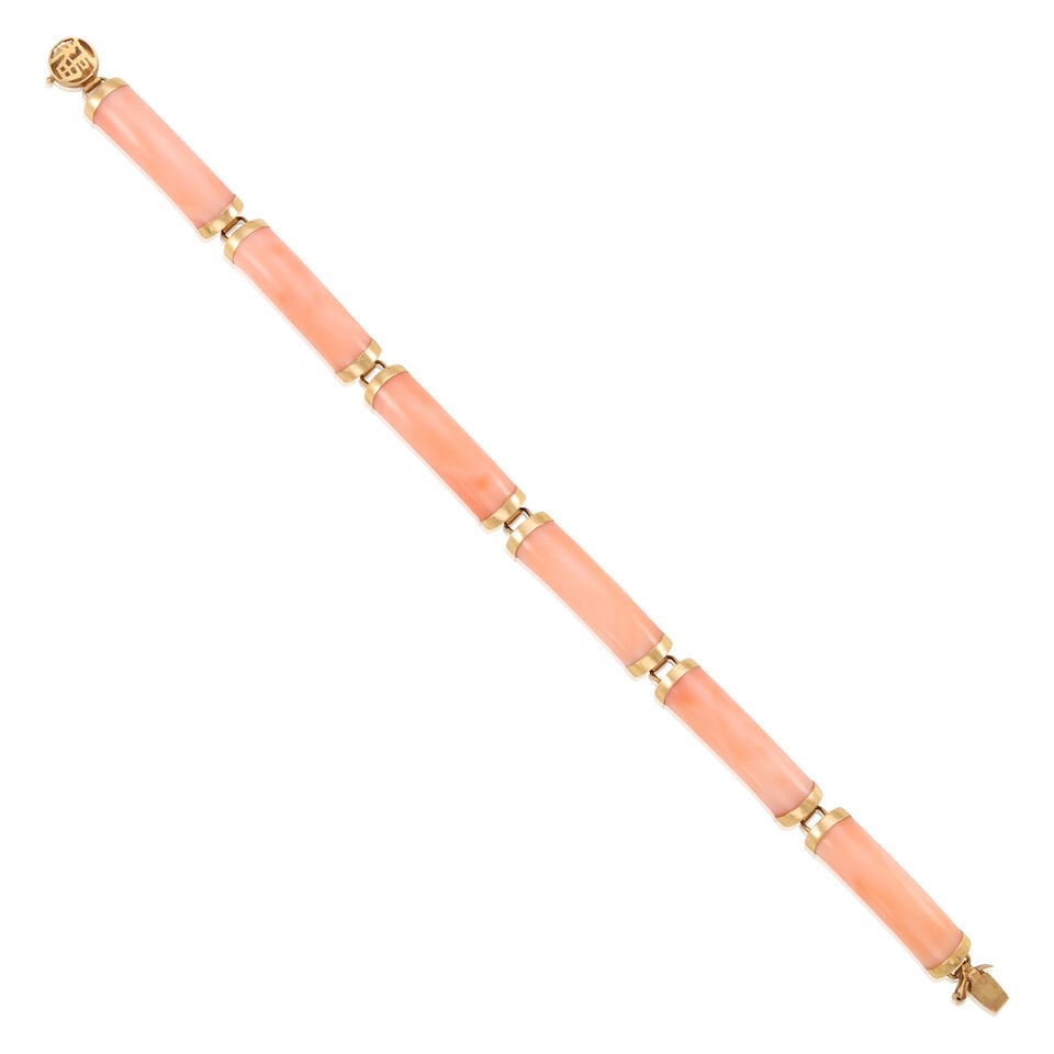 14K GOLD AND CORAL BRACELET: 14K GOLD AND CORAL BRACELET • 14K yellow gold • Six carved coral pieces measuring approximately 23.02mm x 7.05mm x 3.49mm • Length 6 5/8 in. • Estimated gross weight: 10.9