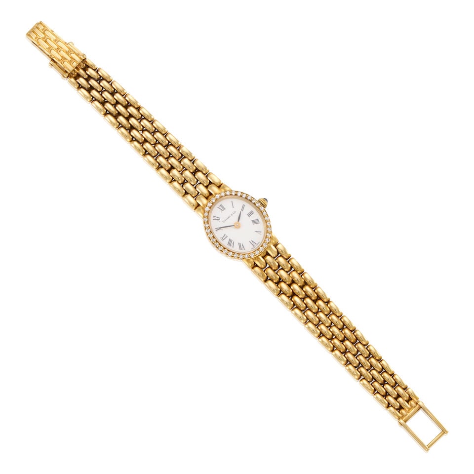 TIFFANY & CO.: 14K GOLD AND DIAMOND WRISTWATCH: TIFFANY & CO.: 14K GOLD AND DIAMOND WRISTWATCH • 14K yellow gold • Dial signed TIFFANY & CO • Quartz movement, currently not working and accurate timekeeping not guaranteed •