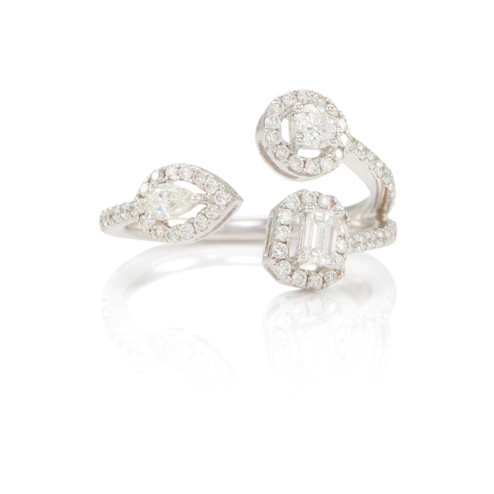 18K GOLD AND DIAMOND RING: 18K GOLD AND DIAMOND RING •18k white gold •3 diamonds of various shapes weighing approximately 0.30 - 0.34 carat total •Numerous round diamonds weighing approximately 0.30 - 0.37