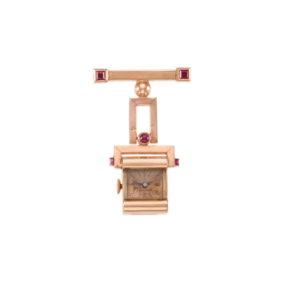 RETRO ERA 14K GOLD AND SYNTHETIC RUBY WATCH BROOCH: RETRO ERA 14K GOLD AND SYNTHETIC RUBY WATCH BROOCH • 14K yellow gold • Square and oval shaped synthetic rubies • Manuel movement, currently not working and accurate timekeeping not