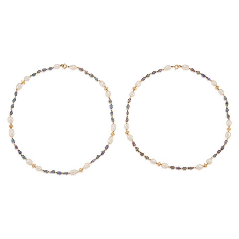 9K GOLD AND CULTURED PEARL NECKLACE: 9K GOLD AND CULTURED PEARL NECKLACE • 9K yellow gold • Numerous cultured pearls ranging in size and shape, largest stone measuring 7.32mm in diameter • Can be worn as one or two