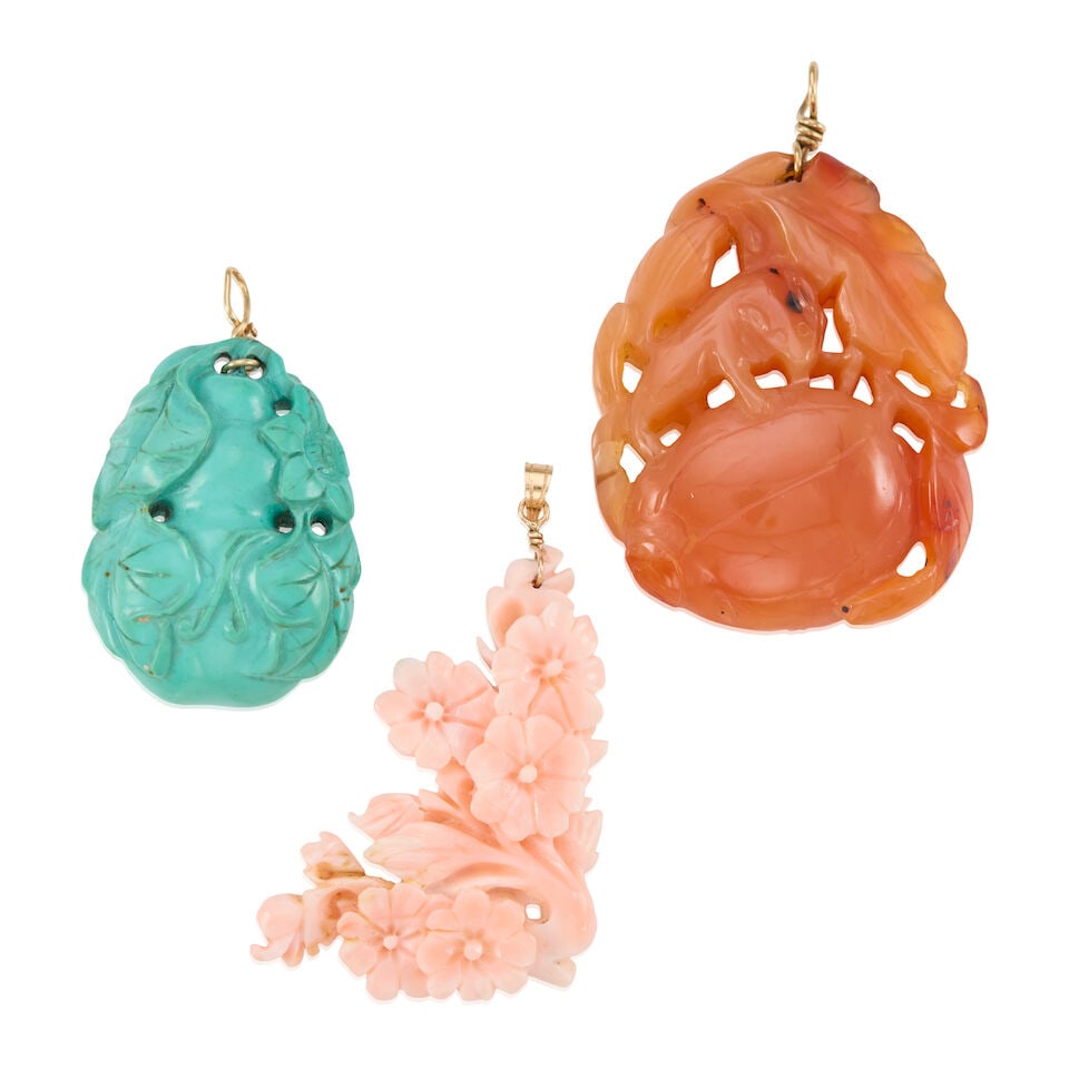 CARVED CORAL AND GEMSTONE PENDANTS: CARVED CORAL AND GEMSTONE PENDANTS • One 10K yellow gold carved chalcedony pendant, measures approximately 2 in. x 1 5/8 in. • One 13K yellow gold carved turquoise pendant, measures