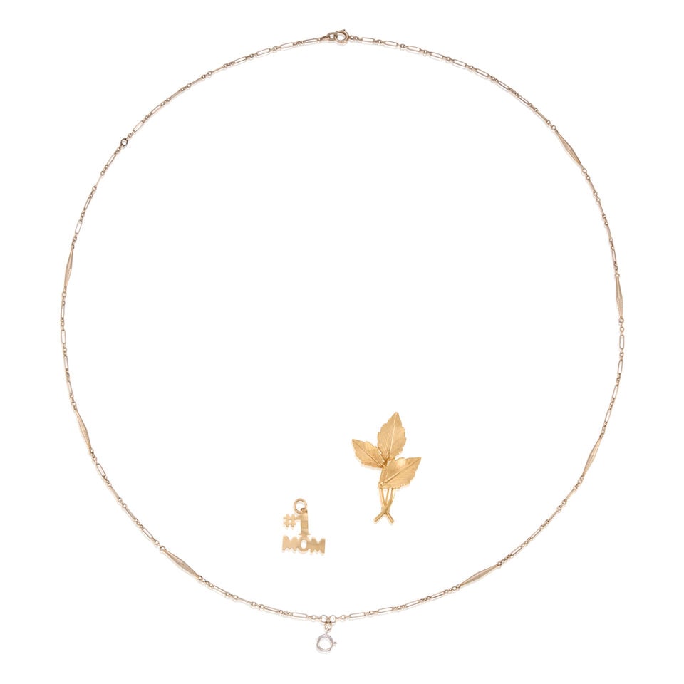 A GROUP OF 14K GOLD JEWLERY: A GROUP OF 14K GOLD JEWLERY • One 14K yellow gold charm, measuring 3/4 in. x 9/16 in. • One 14K yellow gold leaf brooch, stamped VAN DELL, measuring 1 1/2 in. x 1 in. • One 14K