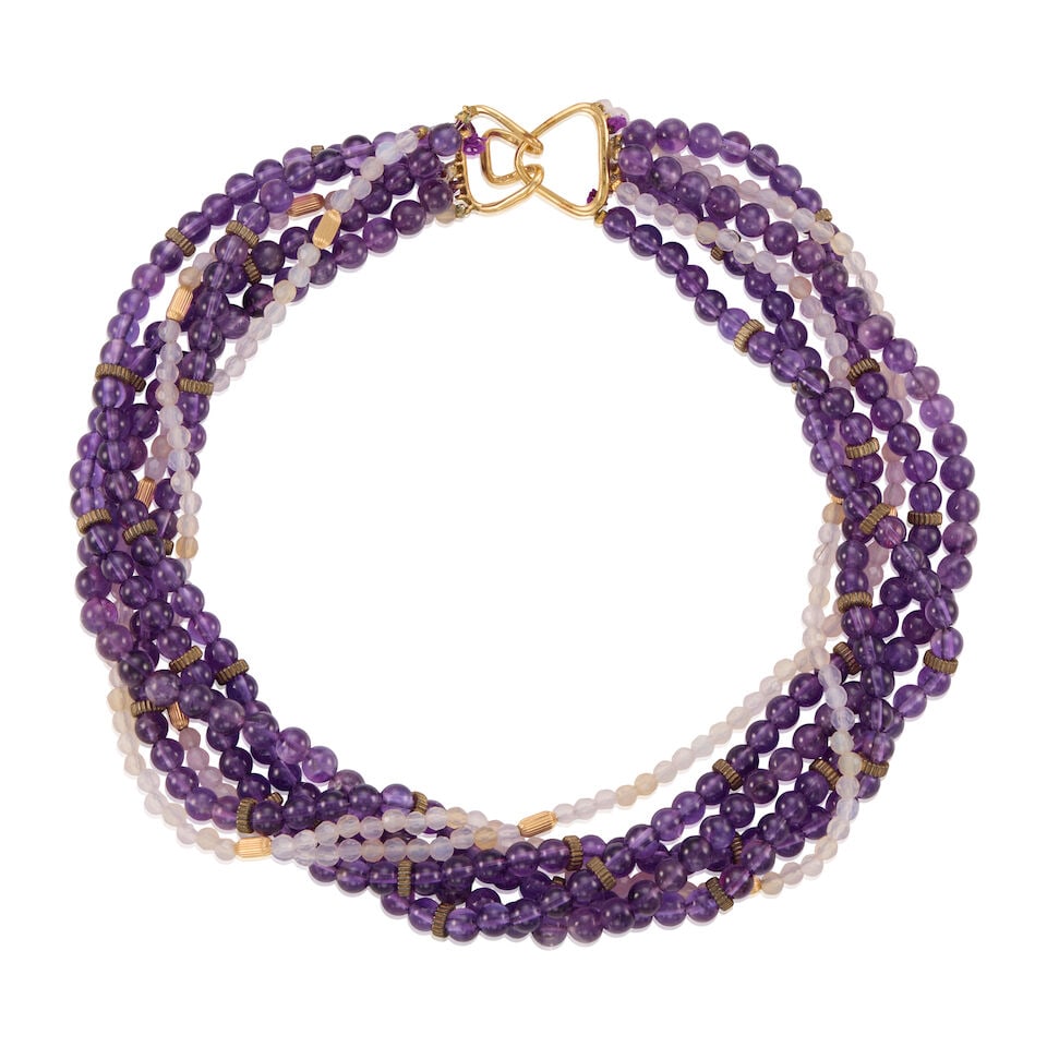 GOLD AND AMETHYST TORSADE NECKLACE: GOLD AND AMETHYST TORSADE NECKLACE • 9K and 14K yellow gold • Numerous amethyst beads measuring approximately 4.15mm to 6.17mm in diameter • Length 16 in. • Estimated gross