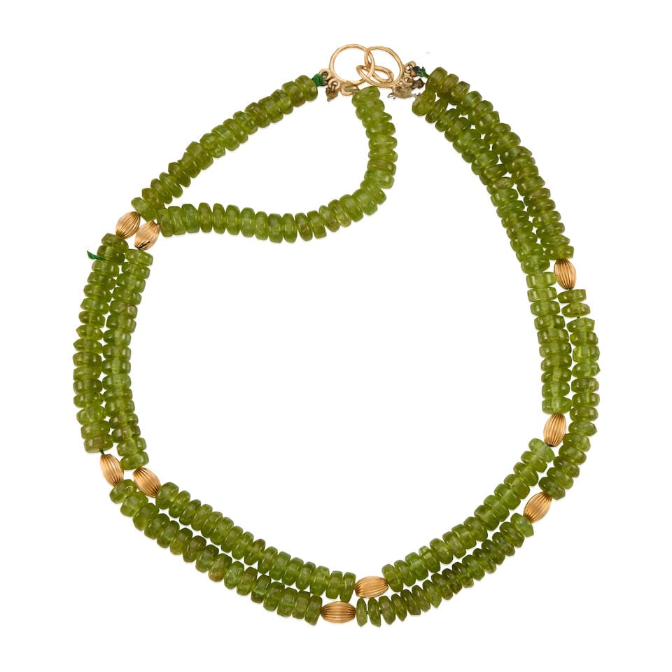 14K GOLD AND PERIDOT NECKLACE: 14K GOLD AND PERIDOT NECKLACE • 14K yellow gold beads • Numerous peridot beads measuring approximately 7.80mm in diameter • Length 16 1/4 in. • Estimated gross weight: 106.4 gr