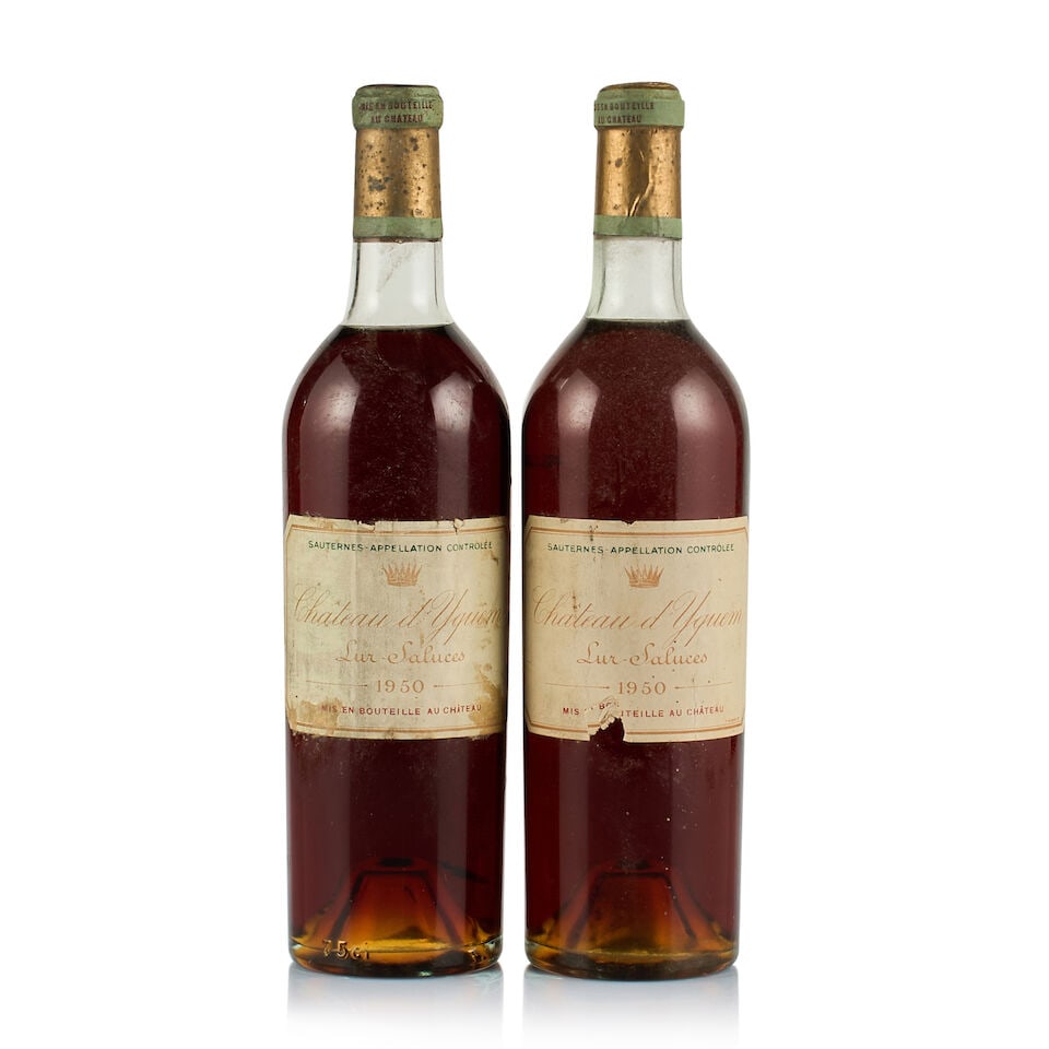 Château d'Yquem, Sauternes, 1er Cru Supérieur, 1950 (2 x 750ml): Château d'Yquem, Sauternes, 1er Cru Supérieur, 1950 (2 x 750ml) Region: Bordeaux Fill Level: 1x top shoulder, 1x very top shoulder Capsule: 2x bin-soiled, stained and slightly corroded Cork: