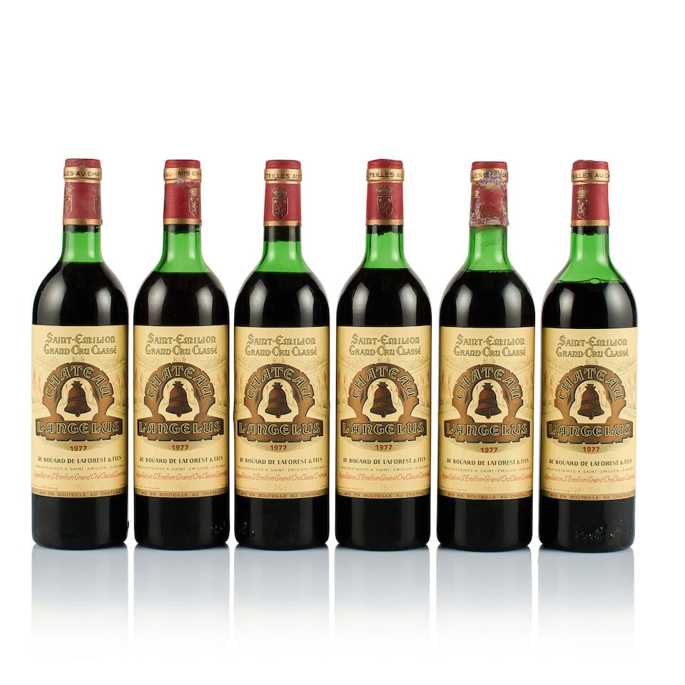 Château L'Angélus, Saint-Emilion Grand Cru, 1977 (6 x 750ml): Château L'Angélus, Saint-Emilion Grand Cru, 1977 (6 x 750ml) Region: Bordeaux Fill Level: 1x mid shoulder, 3x upper shoulder, 2x top shoulder Capsule: all corroded and bin-soiled, 2x old