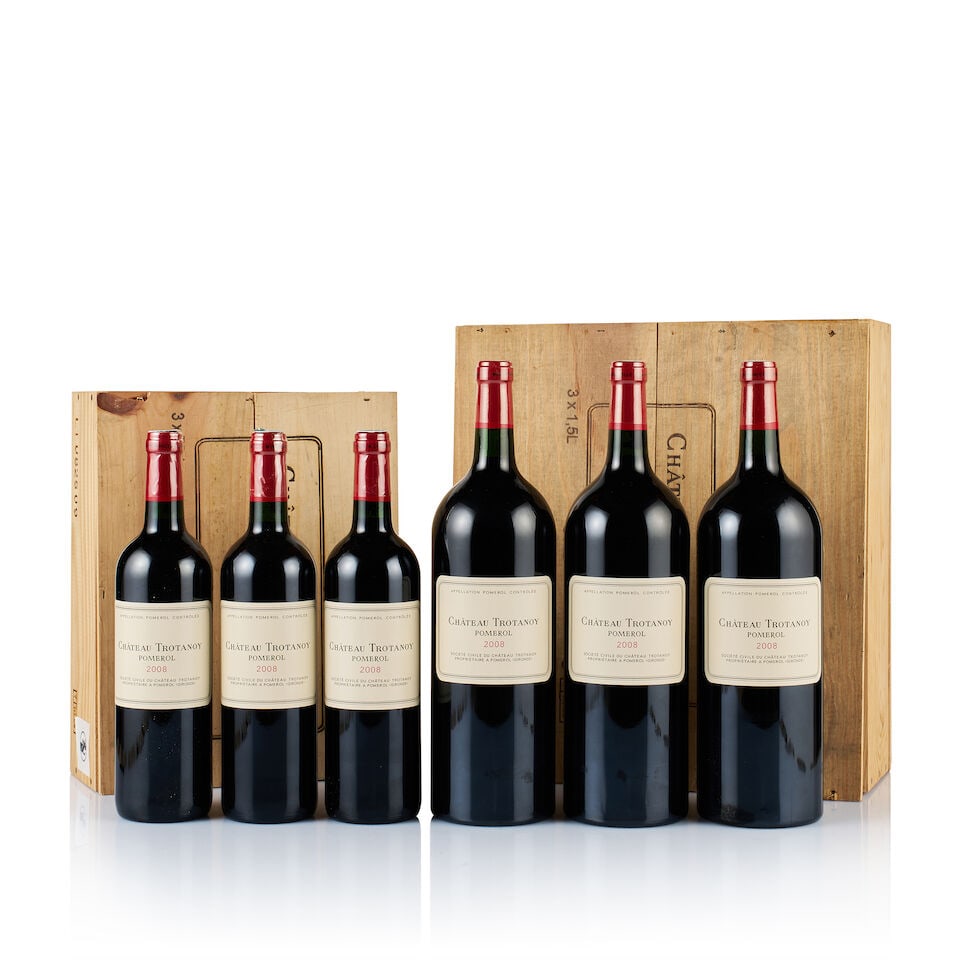 Château Trotanoy, Pomerol, 2007 & 2008 (5 x 750ml & 3 x Magnum): Château Trotanoy, Pomerol, 2007 (2 x 750ml) Region: Bordeaux Fill Level: into neck Capsule: 2x plastic wrapped, ok Cork: ok Label: excellent appearance Packaging: original wooden case Alcohol