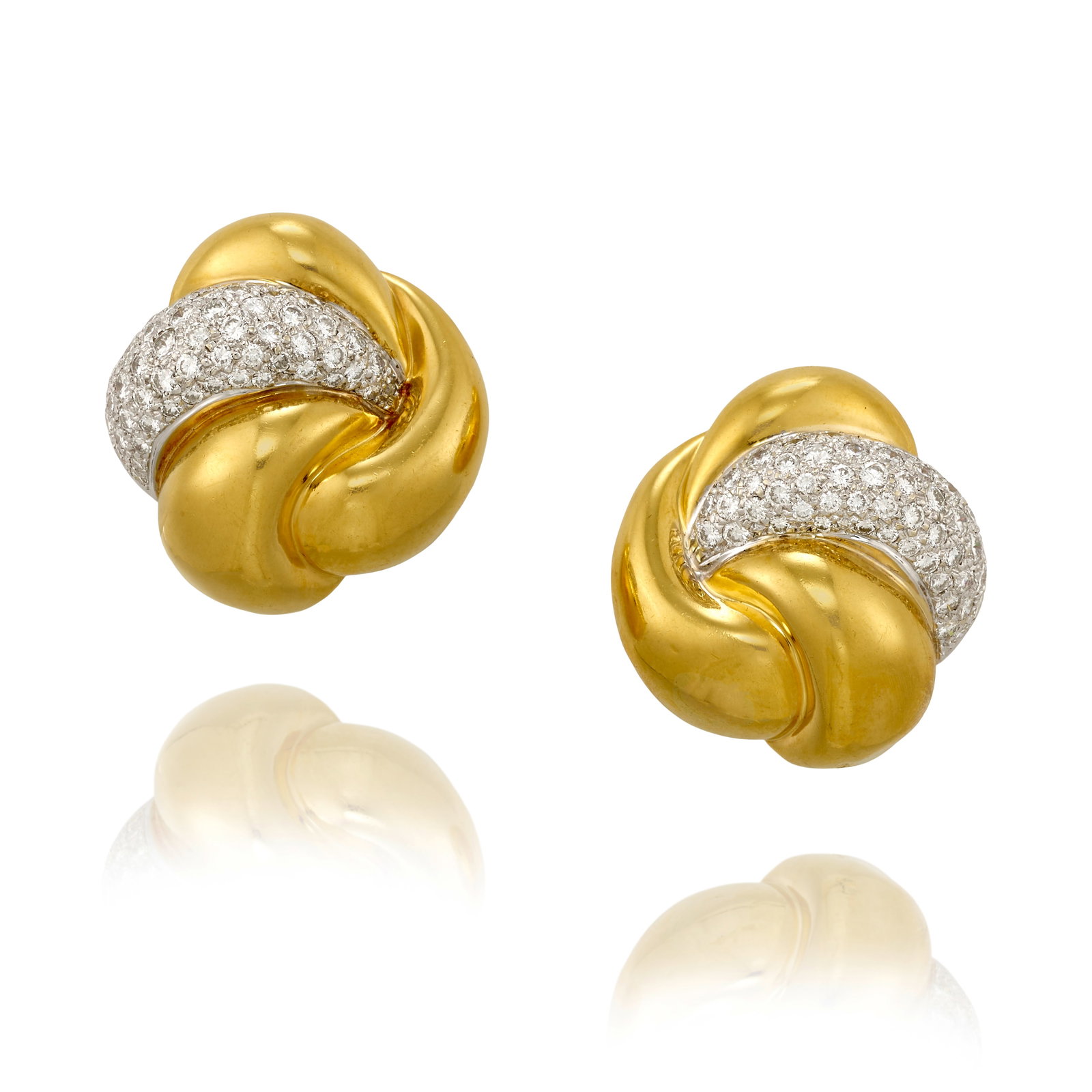 BLACK STARR & FROST: A PAIR OF DIAMOND EARCLIPS: BLACK STARR & FROST: A PAIR OF DIAMOND EARCLIPS Each designed as whorls of yellow and white gold, accented with pavé-set, round brilliant-cut diamonds; with maker's mark; estimated total diamond 