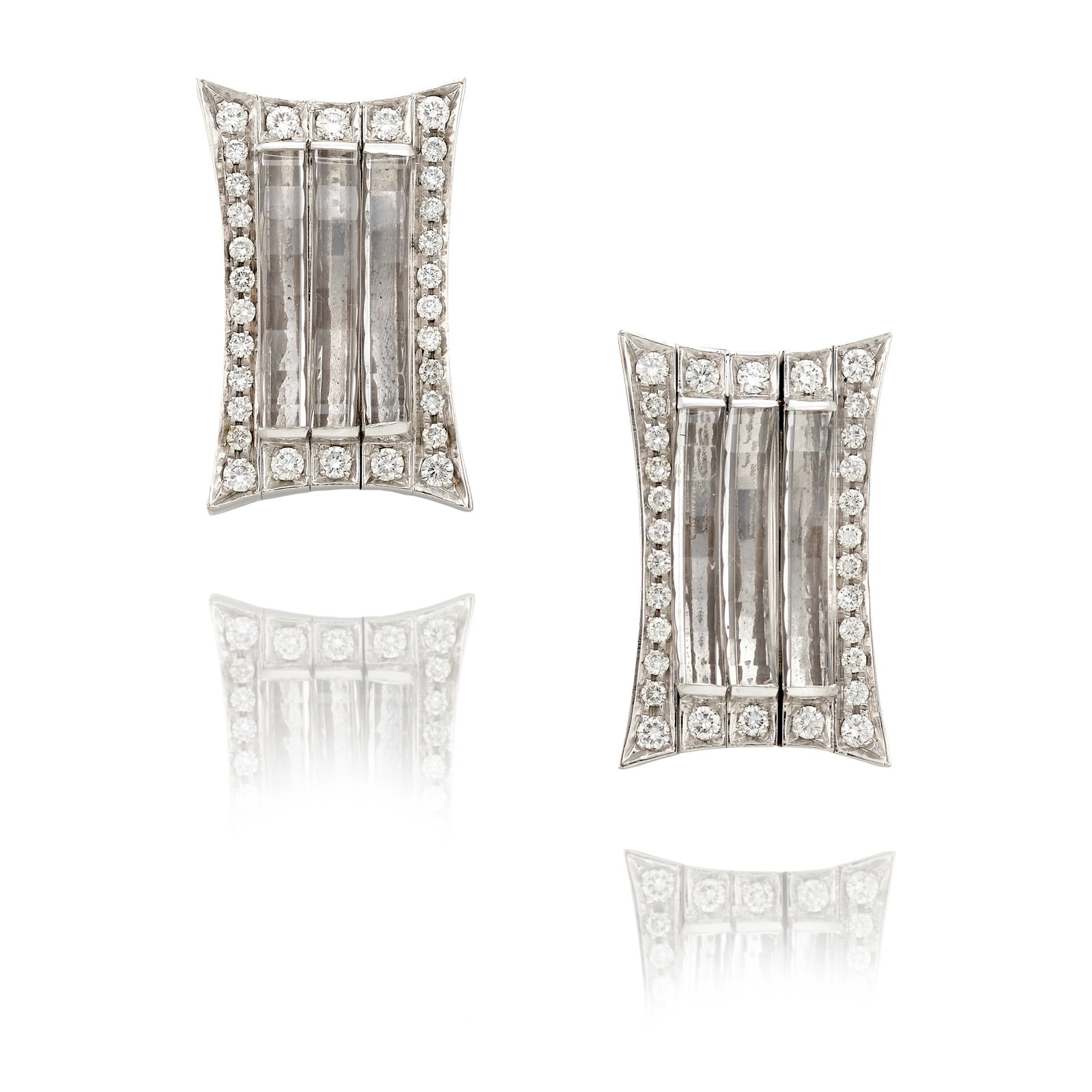 A PAIR OF 18K WHITE GOLD, ROCK CRYSTAL AND DIAMOND EARRINGS: A PAIR OF 18K WHITE GOLD, ROCK CRYSTAL AND DIAMOND EARRINGS Each of geometric design, centering faceted rock crystal elements, framed by round brilliant-cut diamonds; with maker's mark; estimated