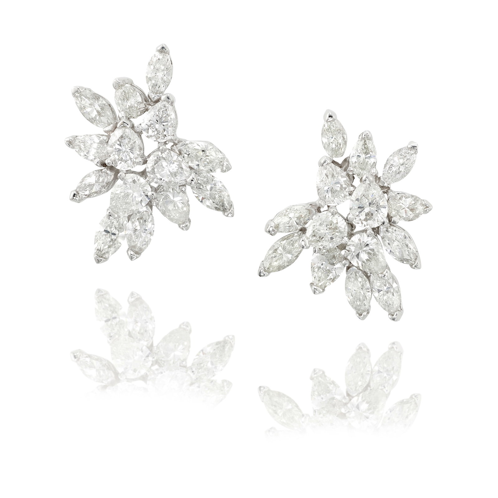 A PAIR OF DIAMOND EARRINGS: A PAIR OF DIAMOND EARRINGS Each of cluster design, comprising pear and marquise-shaped diamonds; estimated total diamond weight 10.90 carats; mounted in 18k white gold; measures 1 3/8 x 1 in. Footnote
