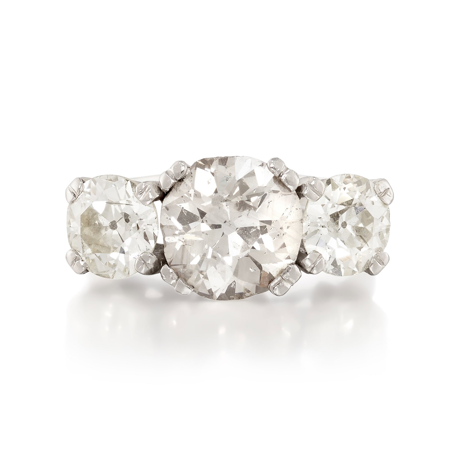 A DIAMOND RING: A DIAMOND RING Centering an old mine-cut diamond, flanked by old European-cut diamonds; estimated center diamond weight 3.10 carats; estimated accent diamond weights 1.20 carats and 1.15 carats, respe