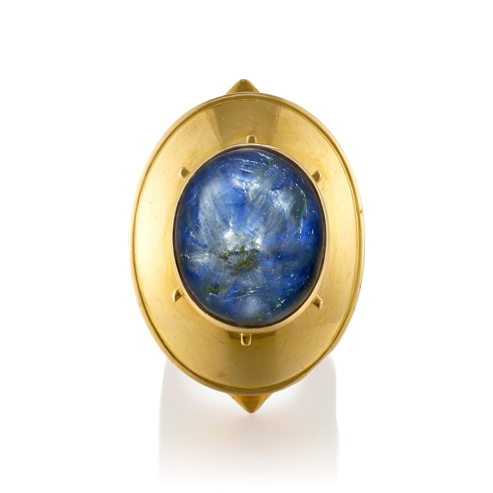 ROD EDWARDS: A 14K GOLD AND SAPPHIRE RING, CIRCA 1970: ROD EDWARDS: A 14K GOLD AND SAPPHIRE RING, CIRCA 1970 Of sculptural design, centering an oval-shaped, trapiche-type cabochon sapphire; signed Rod Edwards; with maker's mark; with English hallmarks,