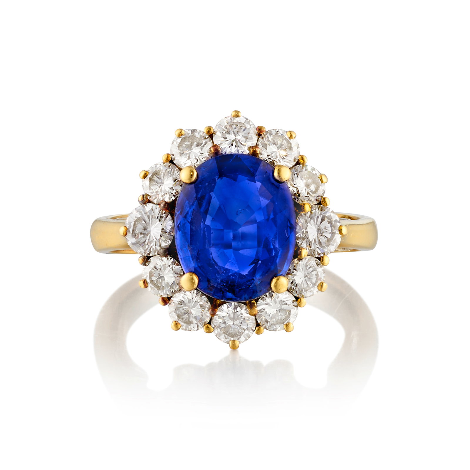 A SAPPHIRE AND DIAMOND RING: A SAPPHIRE AND DIAMOND RING Centering an oval-shaped sapphire, in a surround of round brilliant-cut diamonds; estimated sapphire weight 3.85 carats; estimated total diamond weight 1.70 carats; mounted