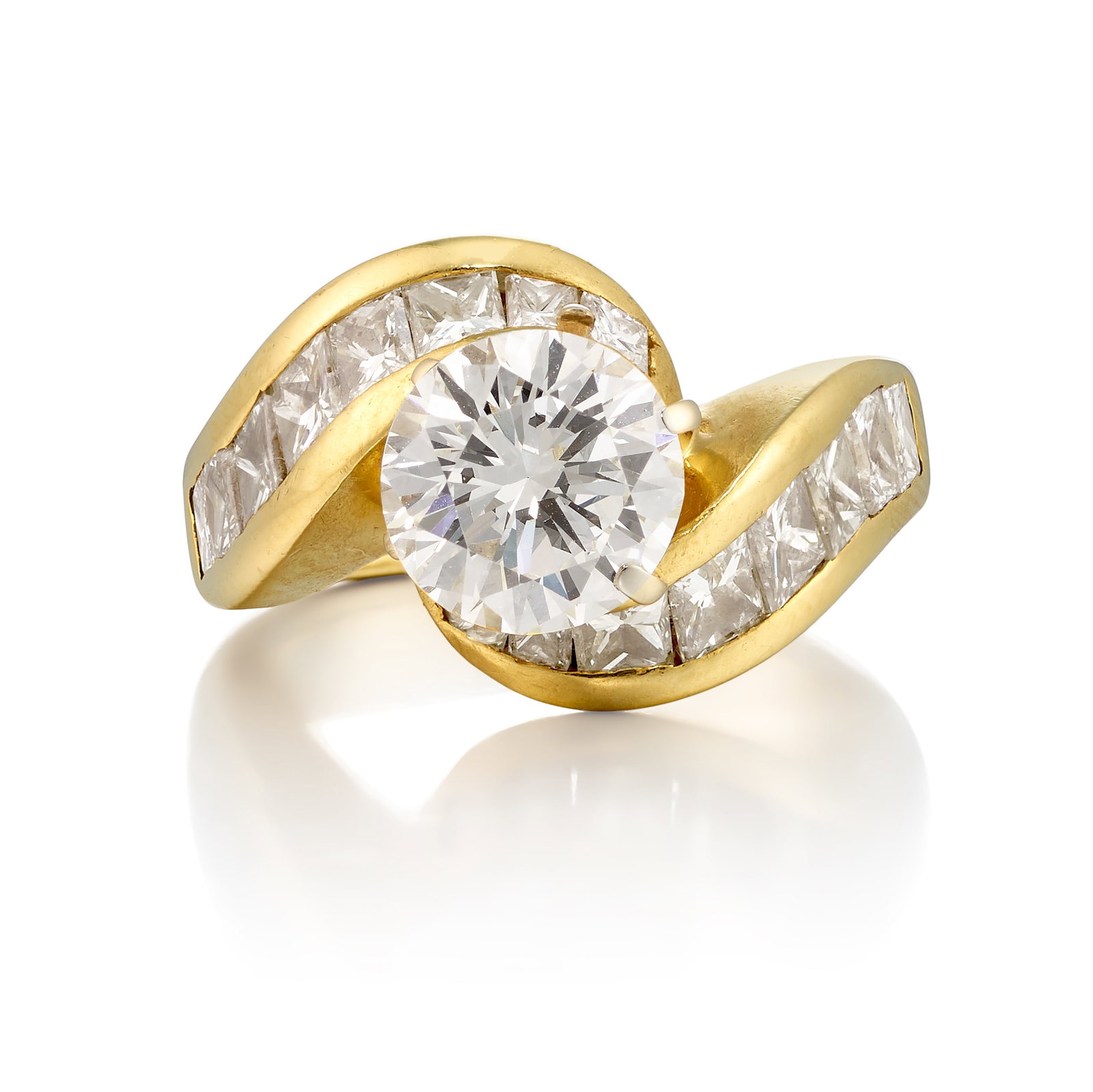 A 14K GOLD AND DIAMOND RING: A 14K GOLD AND DIAMOND RING Centering a round brilliant-cut diamond, weighing 2.16 carats, in a surround of rectangular and square mixed-cut diamonds; estimated remaining diamond weight 1.55 carats; s