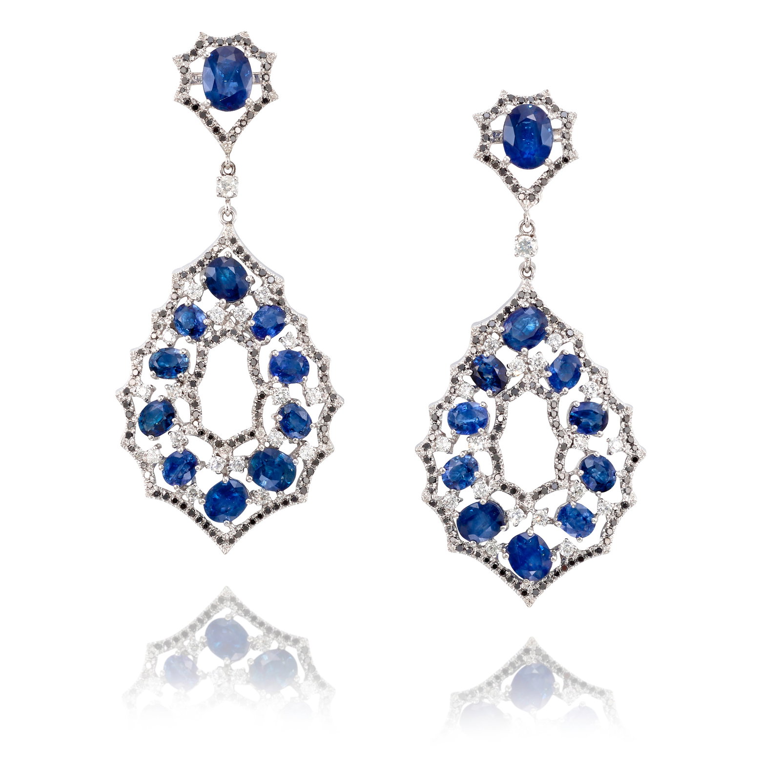 A PAIR OF 18K WHITE GOLD, SAPPHIRE AND DIAMOND EARRINGS: A PAIR OF 18K WHITE GOLD, SAPPHIRE AND DIAMOND EARRINGS Each of scallop-edged, openwork design, comprising oval-shaped sapphires, accented round brilliant-cut diamonds and black round brilliant-cut