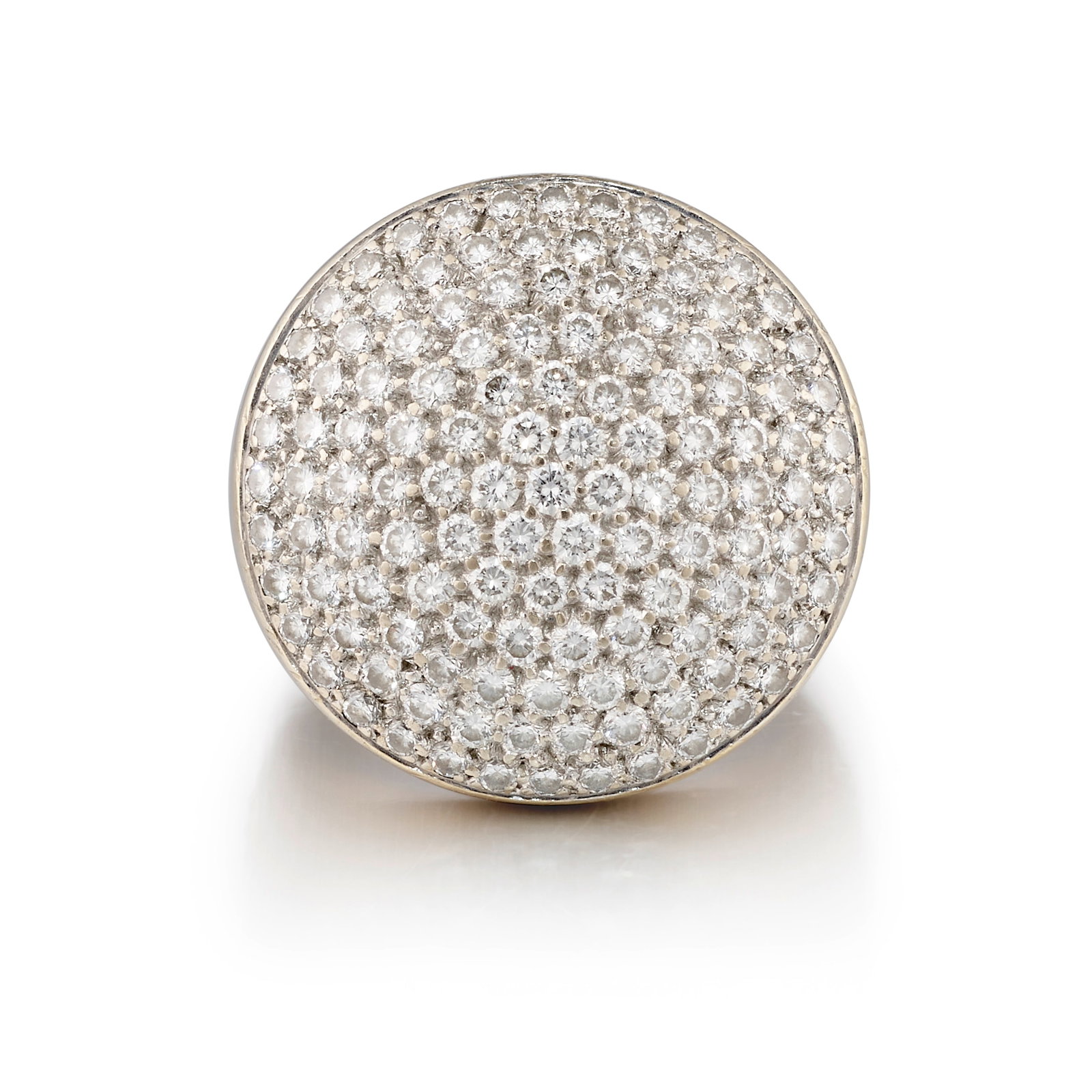 CARTIER: AN 18K WHITE GOLD AND DIAMOND 'JETON SAUVAGE' RING: CARTIER: AN 18K WHITE GOLD AND DIAMOND 'JETON SAUVAGE' RING Of circular, slightly domed form, pavé-set across with round brilliant-cut diamonds; signed Cartier; with partial maker's mark; with Fr