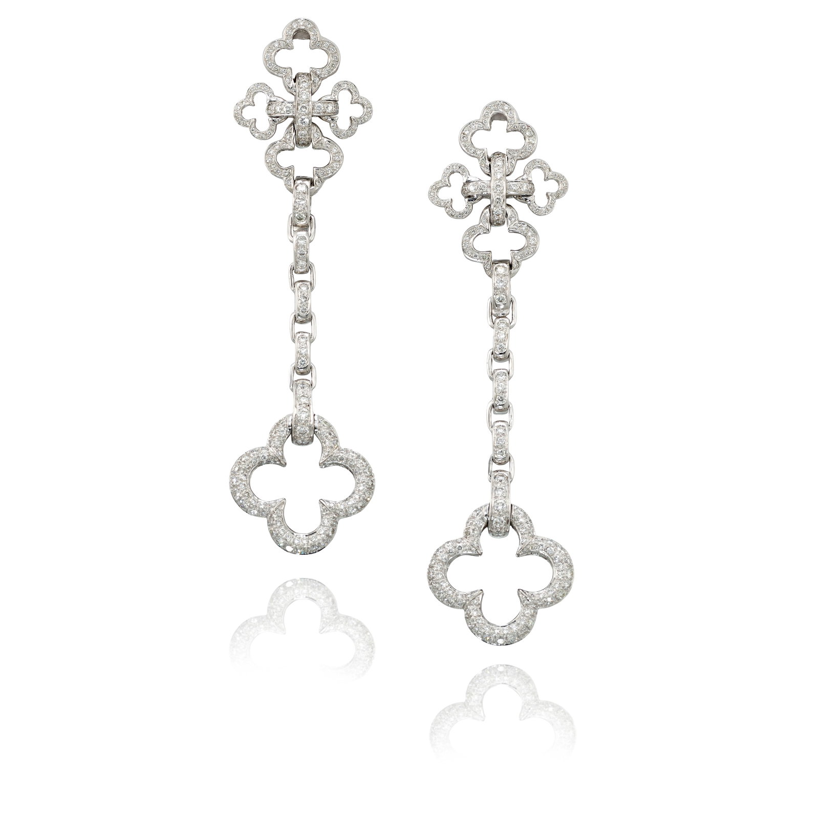 HEIDI KLUM FOR MOUAWAD: A PAIR OF 18K WHITE GOLD AND DIAMOND CONVERTIBLE EARRINGS: HEIDI KLUM FOR MOUAWAD: A PAIR OF 18K WHITE GOLD AND DIAMOND CONVERTIBLE EARRINGS Each of quatrefoil motif, accented with round brilliant-cut diamonds, with removable drop pendants and collapsible pos