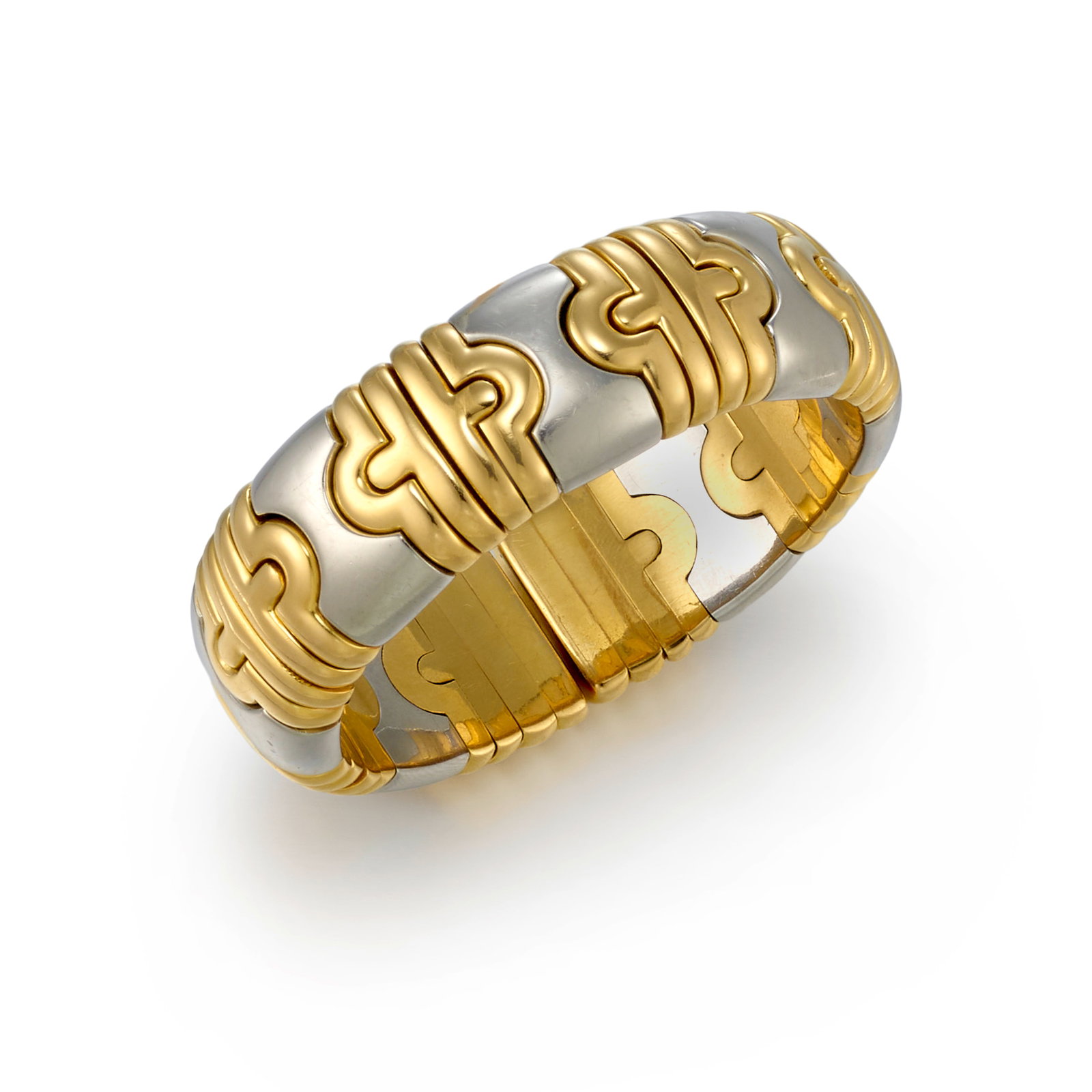 BULGARI: AN 18K GOLD AND STAINLESS STEEL 'PARENTESI' BRACELET: BULGARI: AN 18K GOLD AND STAINLESS STEEL 'PARENTESI' BRACELET A flexible cuff bracelet, alternating gold and stainless steel geometric elements; signed Bulgari; with Italian registered trademark; inne