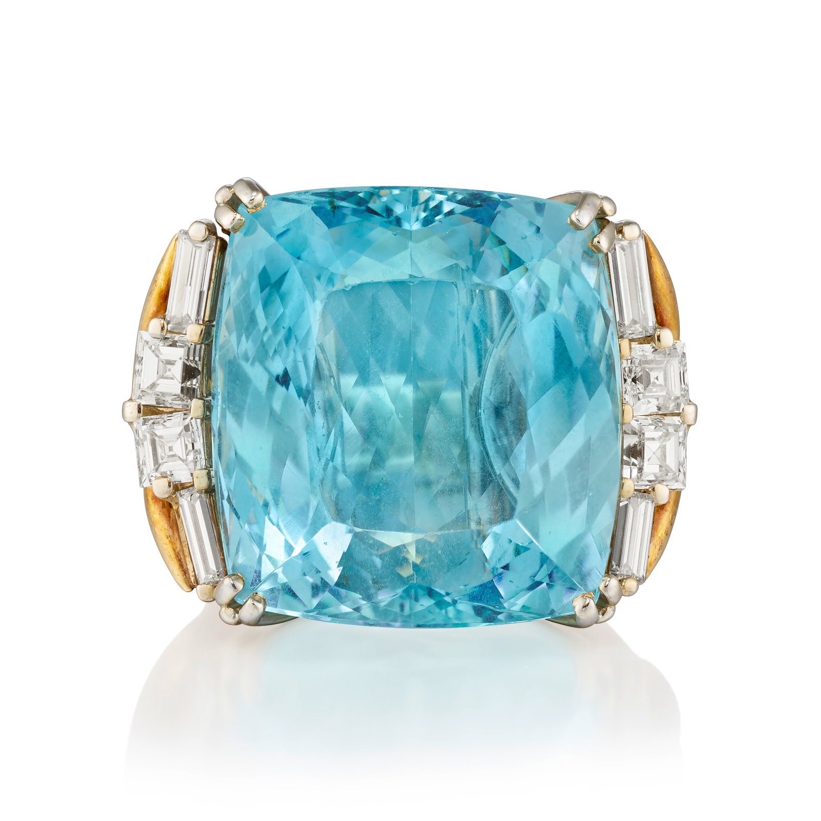 AN 18K GOLD, AQUAMARINE AND DIAMOND RING: AN 18K GOLD, AQUAMARINE AND DIAMOND RING Centering a cushion-shaped aquamarine, flanked by square step and baguette-cut diamonds; estimated aquamarine weight 29.45 carats; estimated total diamond weig