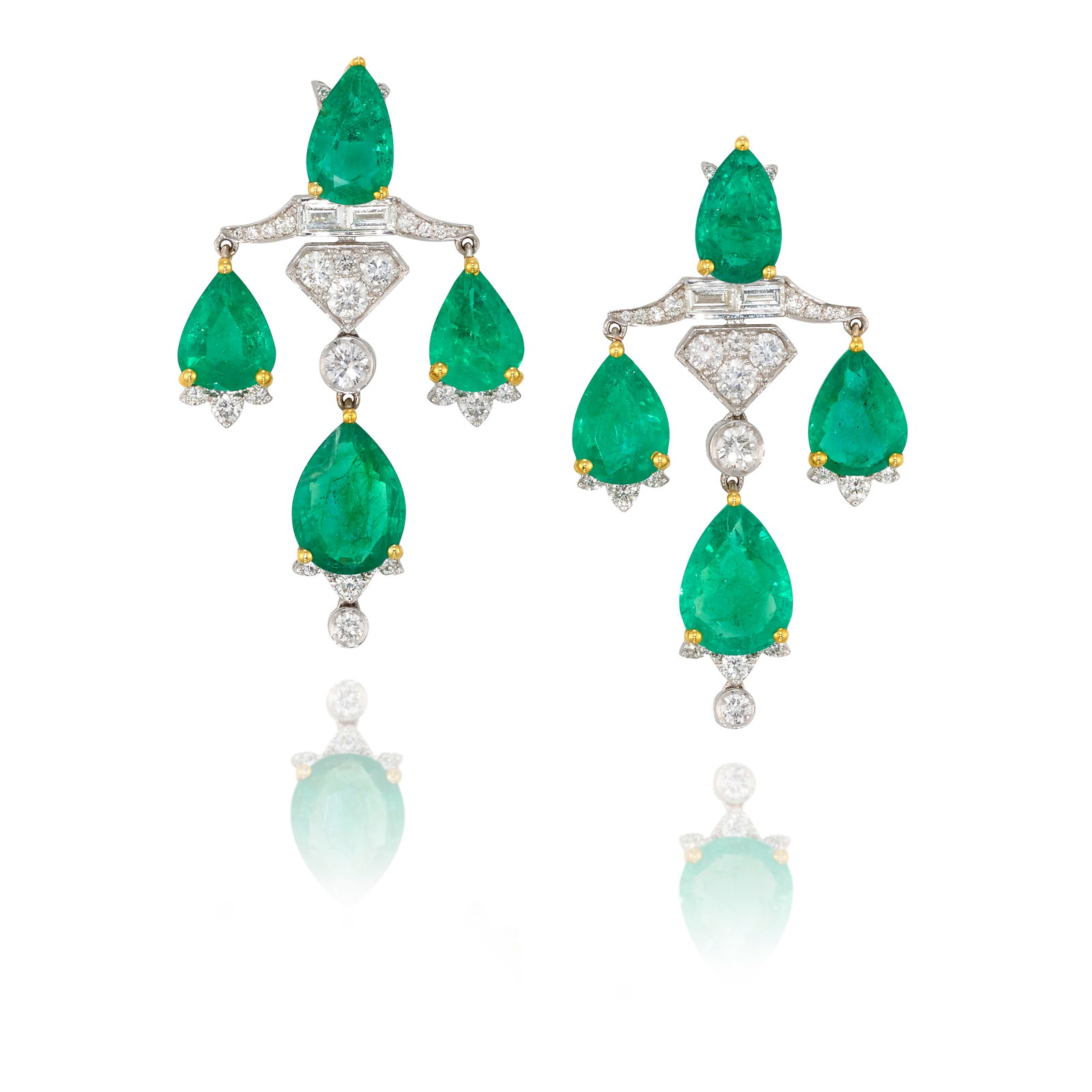 A PAIR OF 18K WHITE GOLD, EMERALD AND DIAMOND EARRINGS: A PAIR OF 18K WHITE GOLD, EMERALD AND DIAMOND EARRINGS Each of chandelier design, comprising pear-shaped emeralds, accented by round brilliant and baguette-cut diamonds; estimated total emerald weight