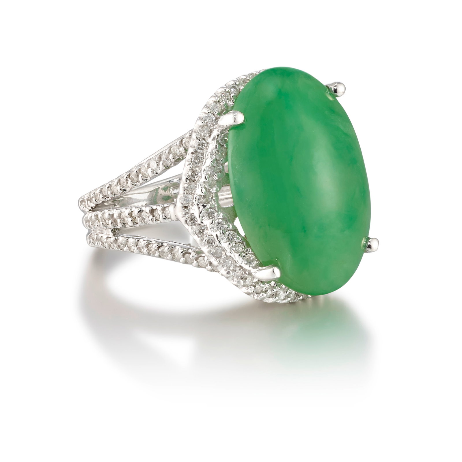 A 14K WHITE GOLD, JADE AND DIAMOND RING: A 14K WHITE GOLD, JADE AND DIAMOND RING Centering an oval-shaped cabochon jade, weighing 18.67 carats, accented with round brilliant-cut diamonds; estimated total diamond weight 1.20 carats; size 7 1/