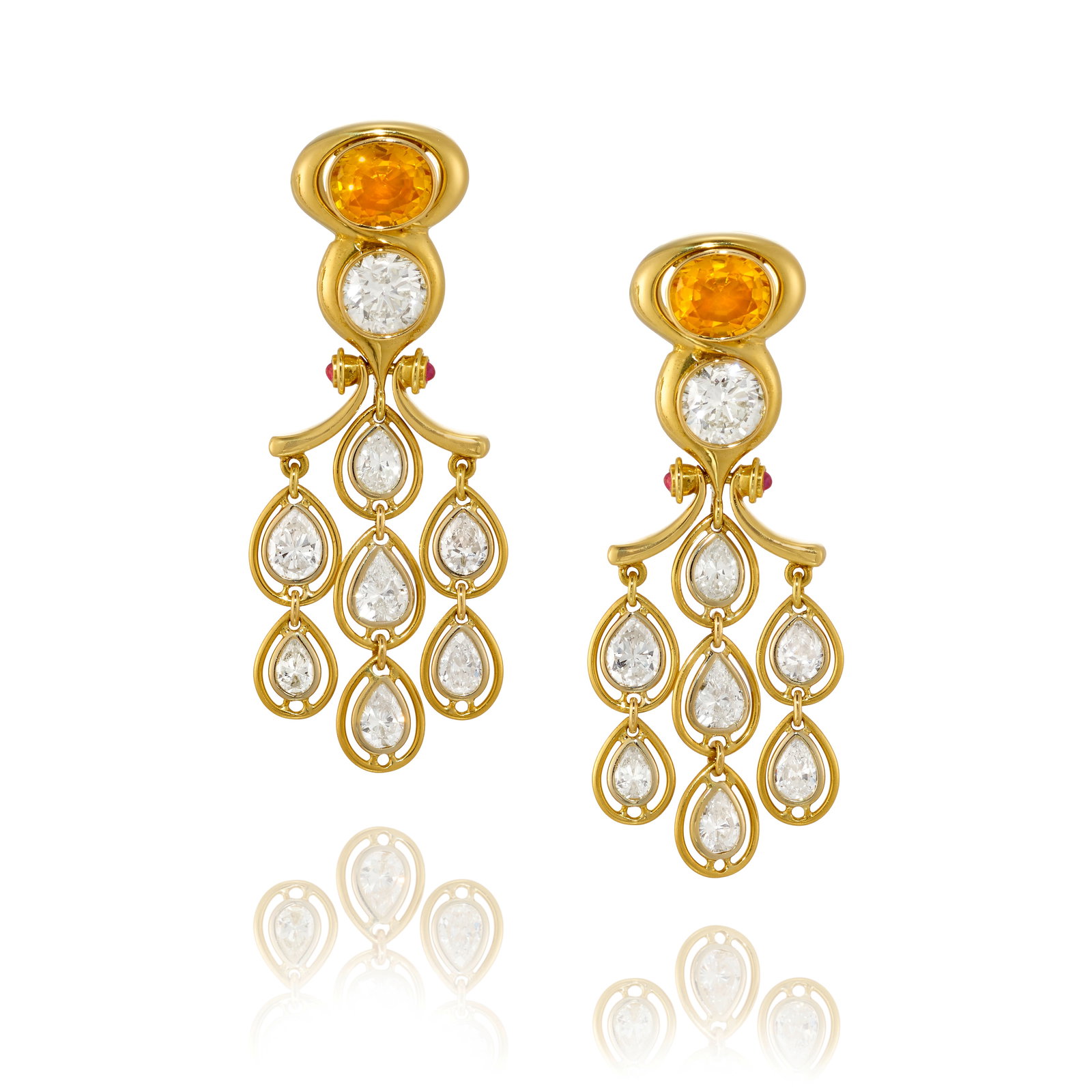 A PAIR OF 18K GOLD, ORANGE SAPPHIRE, DIAMOND AND RUBY EARRINGS: A PAIR OF 18K GOLD, ORANGE SAPPHIRE, DIAMOND AND RUBY EARRINGS Each of chandelier design, pairing oval-shaped orange sapphires and round brilliant-cut diamonds, suspending pear-shaped diamond fringe a