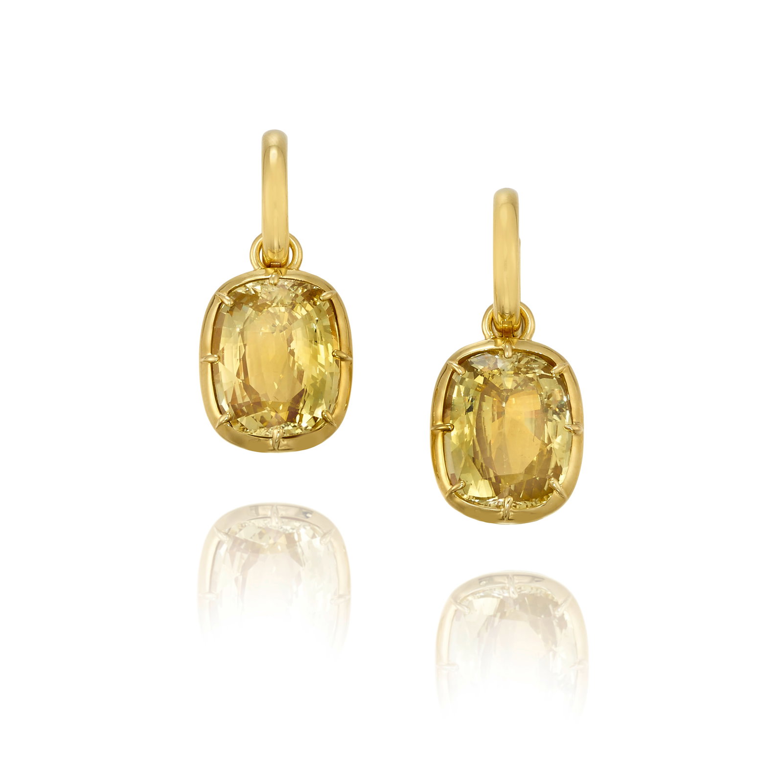 A PAIR OF YELLOW SAPPHIRE EARRINGS: A PAIR OF YELLOW SAPPHIRE EARRINGS A pair of hoop earrings, each suspending removable pendants of cushion-shaped yellow sapphires, weighing 10.80 carats and 10.76 carats, respectively; fabricated and
