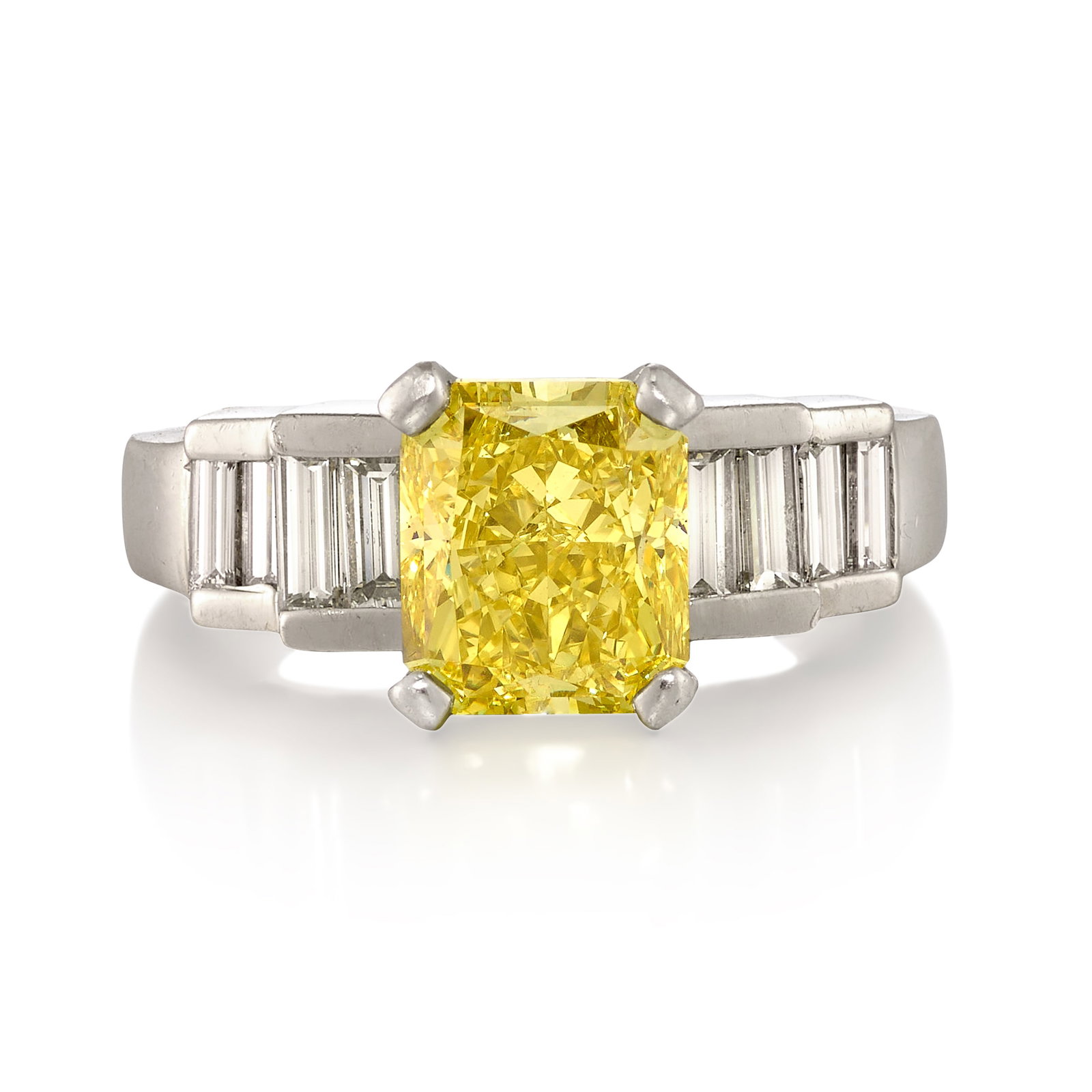 A PLATINUM, FANCY INTENSE YELLOW DIAMOND AND DIAMOND RING: A PLATINUM, FANCY INTENSE YELLOW DIAMOND AND DIAMOND RING Centering a cut-cornered rectangular, modified brilliant-cut, Fancy Intense Yellow diamond, weighing 2.76 carats, flanked by baguette-cut
