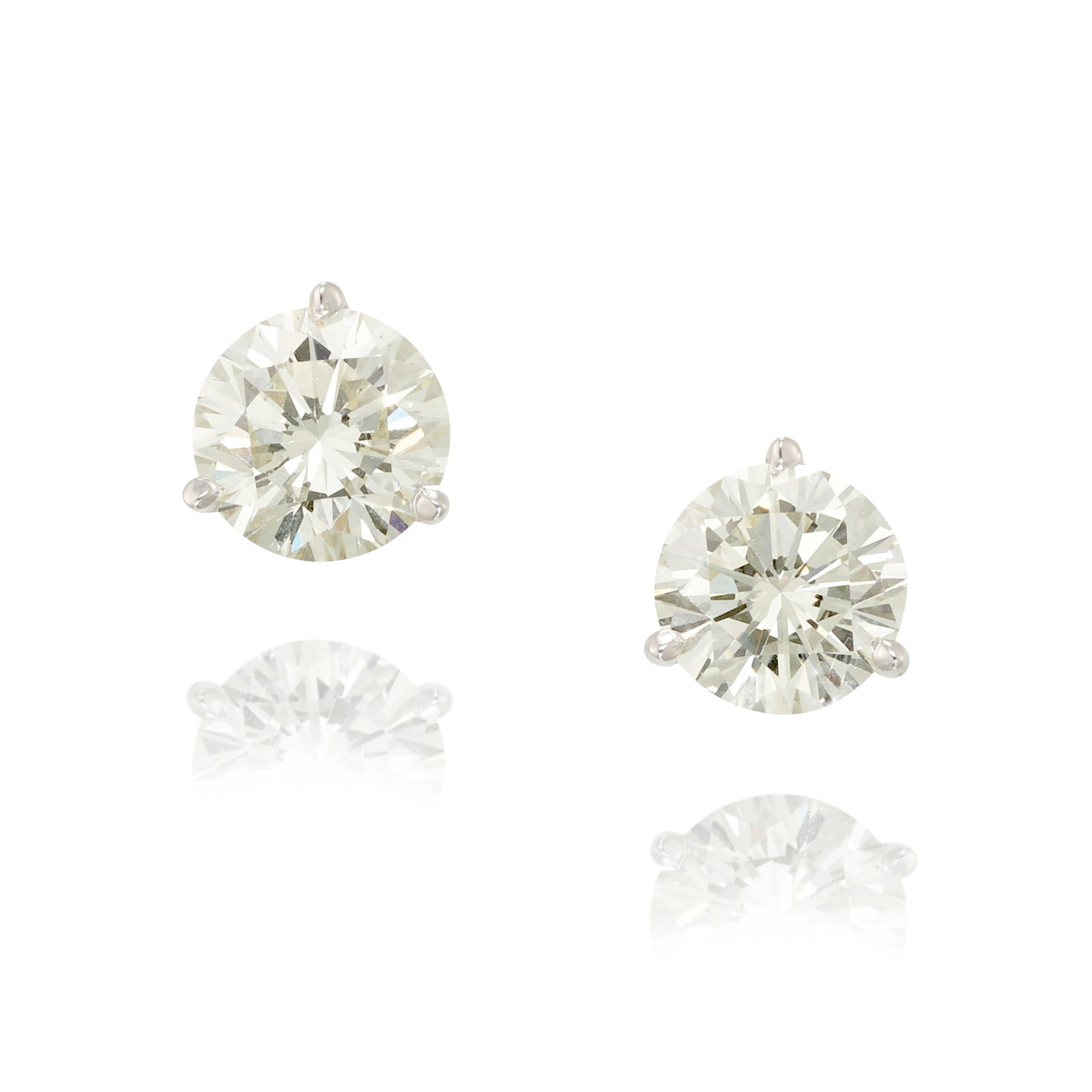 A PAIR OF DIAMOND EARRINGS: A PAIR OF DIAMOND EARRINGS Each set with round brilliant-cut diamonds; estimated diamond weights 2.15 carats and 2.00 carats, respectively; mounted in 14k white gold; measures 5 /16 in. Footnotes: