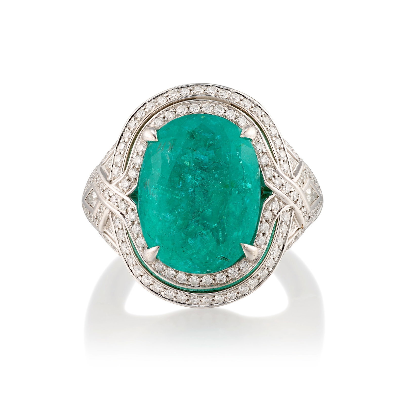 KAT FLORENCE: AN 18K WHITE GOLD, PARAÍBA-TYPE TOURMALINE AND DIAMOND RING: KAT FLORENCE: AN 18K WHITE GOLD, PARAÍBA-TYPE TOURMALINE AND DIAMOND RING Centering an oval-shaped, Paraíba-type tourmaline, mounted in a surround of round brilliant-cut and kite-shaped