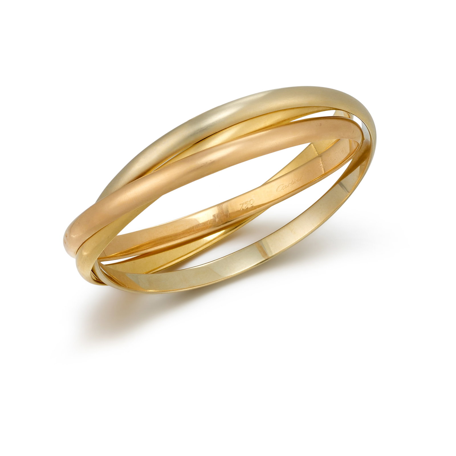 CARTIER: AN 18K TRICOLOR GOLD 'TRINITY' BRACELET: CARTIER: AN 18K TRICOLOR GOLD 'TRINITY' BRACELET Designed as interlocking bangles of white, yellow and pink gold; signed Cartier; with maker's mark; with French assay marks; with serial number; inner 