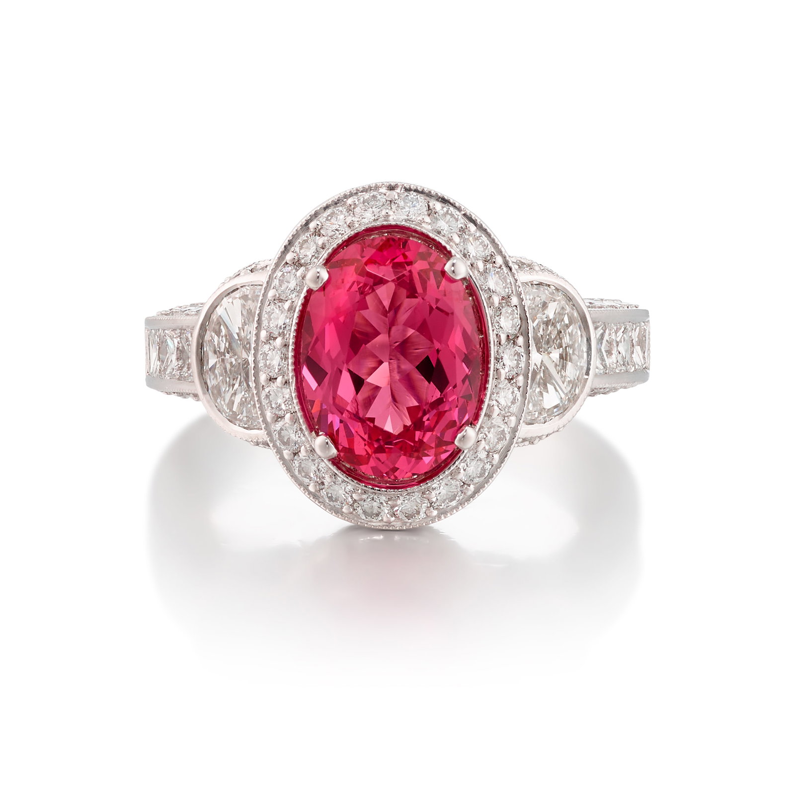 A PLATINUM, PINK SPINEL AND DIAMOND RING: A PLATINUM, PINK SPINEL AND DIAMOND RING Centering an oval-shaped pink spinel, weighing 2.24 carats, accented across by round brilliant-cut, square and half moon-shaped diamonds; with maker's marks;